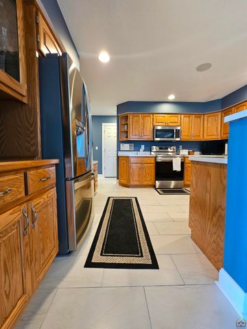 1525 SW Village DR, Topeka, KS 66604