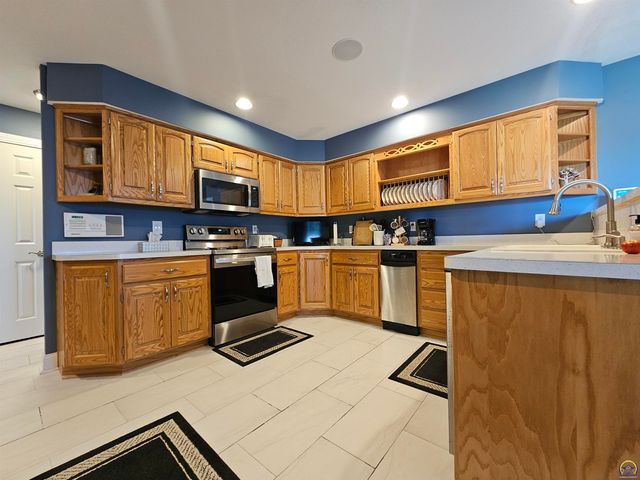 1525 SW Village DR, Topeka, KS 66604