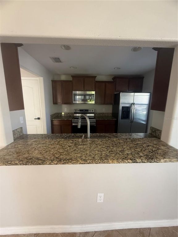 Image 8 of property listing at 9749 TRUMPET VINE LOOP, Trinity, FL 34655