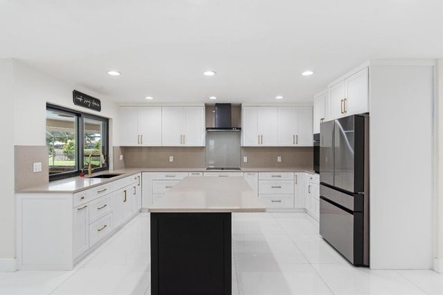 516 Muirfield Drive, Atlantis, FL 33462