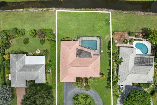 516 Muirfield Drive, Atlantis, FL 33462