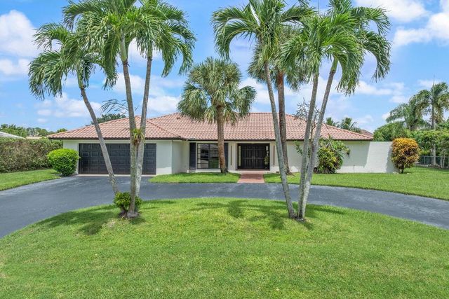 516 Muirfield Drive, Atlantis, FL 33462
