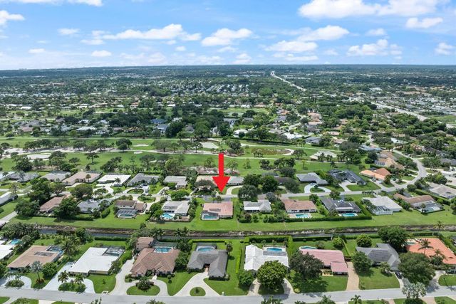 516 Muirfield Drive, Atlantis, FL 33462
