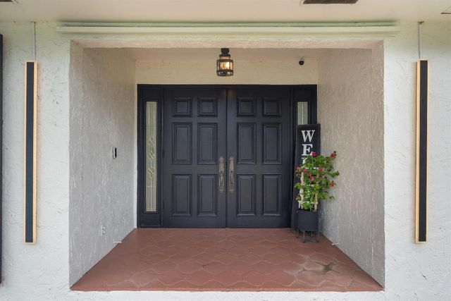 516 Muirfield Drive, Atlantis, FL 33462