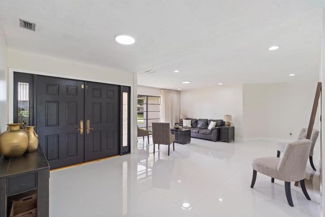 516 Muirfield Drive, Atlantis, FL 33462