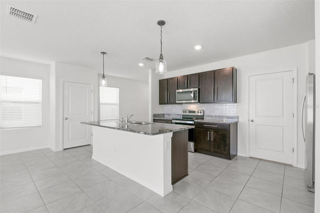 5495 WARRINGTON TOWN PATH, Wesley Chapel, FL 33545