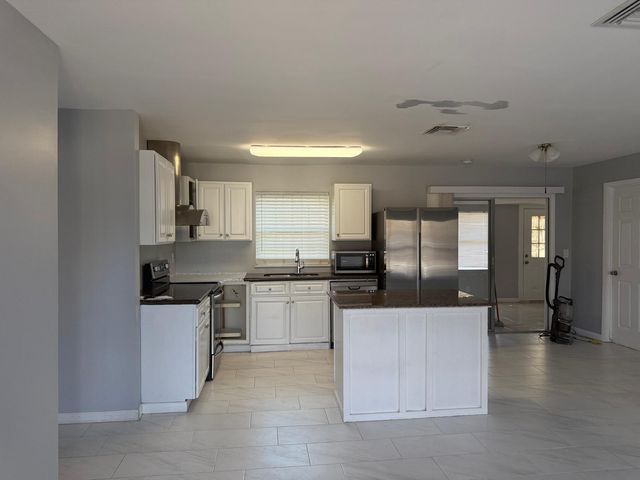 107 NW Curtis Street, Port St. Lucie, Port St Lucie, FL 34983