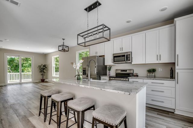 1673 Carriage Ln., Little River, SC 29566