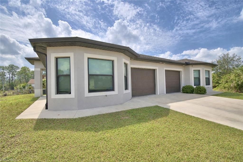 713/715 W 12th ST, LEHIGH ACRES, FL 33972 — exterior