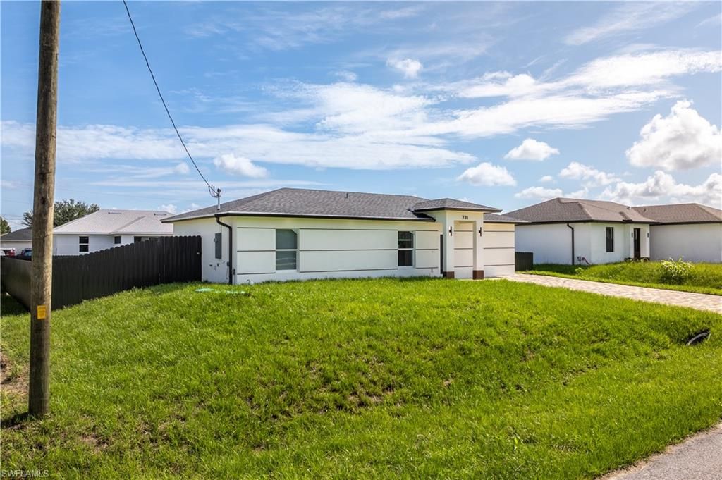 413 Eisenhower BLVD, LEHIGH ACRES, FL 33974 — exterior