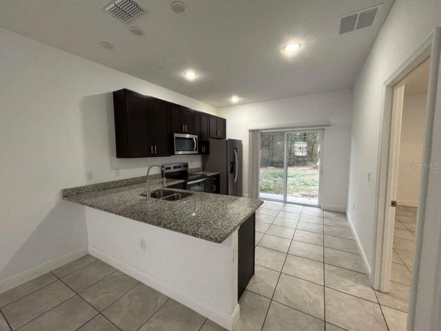 9130 N MENDOZA WAY 1, Citrus Springs, FL 34434