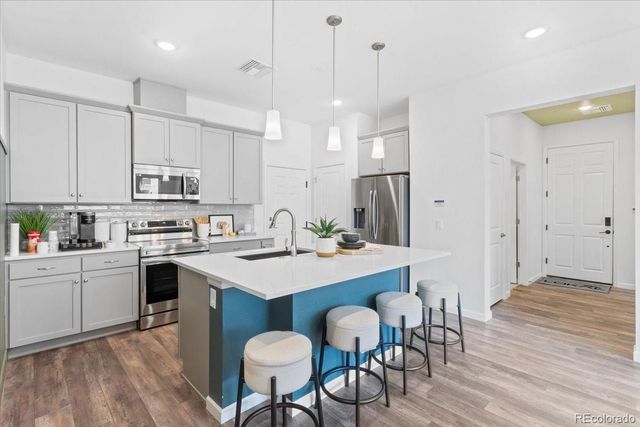 6153 N Ceylon Street 9-102, Denver, CO 80249