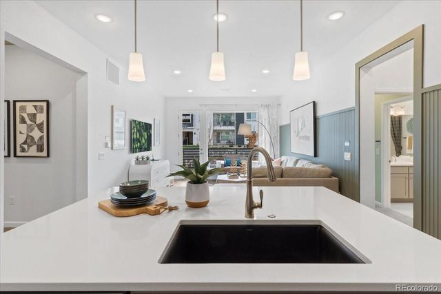 6153 N Ceylon Street 9-102, Denver, CO 80249