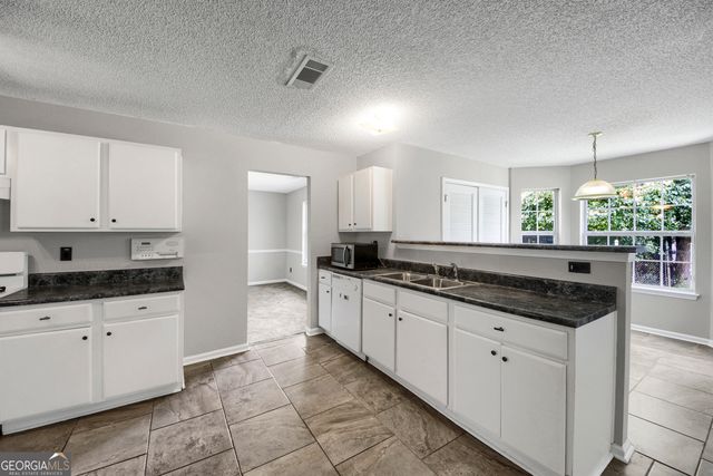 6010 Crooked Creek Drive, Rex, GA 30273