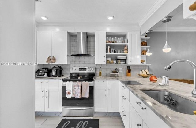789 Crystal Lake Drive, Deerfield Beach, FL 33064