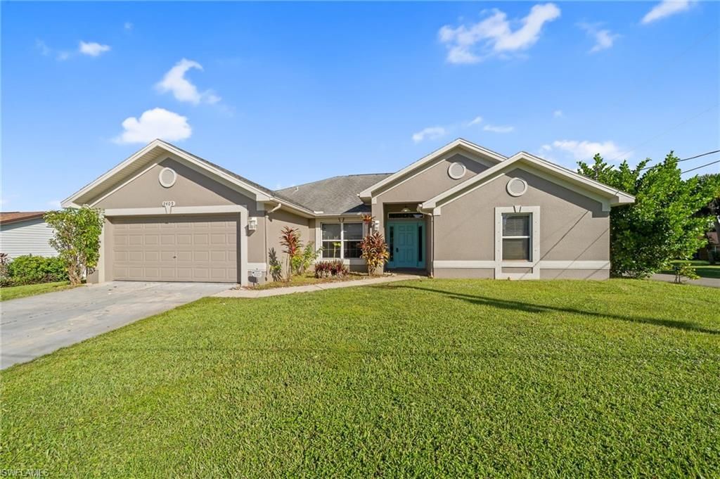 2409 EDGEWATER WAY, LEHIGH ACRES, FL 33936 — exterior