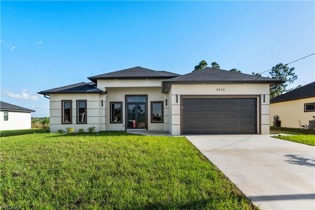 2813 19TH ST SW, LEHIGH ACRES, FL 33976 — exterior