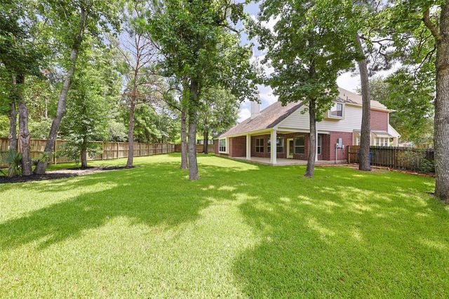 403 Woodpecker Forest Lane, Conroe, TX 77384