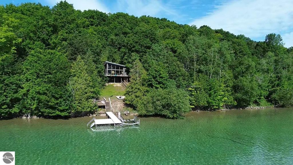 Image 1 of property listing at 7681 NW Torch Lake Drive, Kewadin, MI 49648