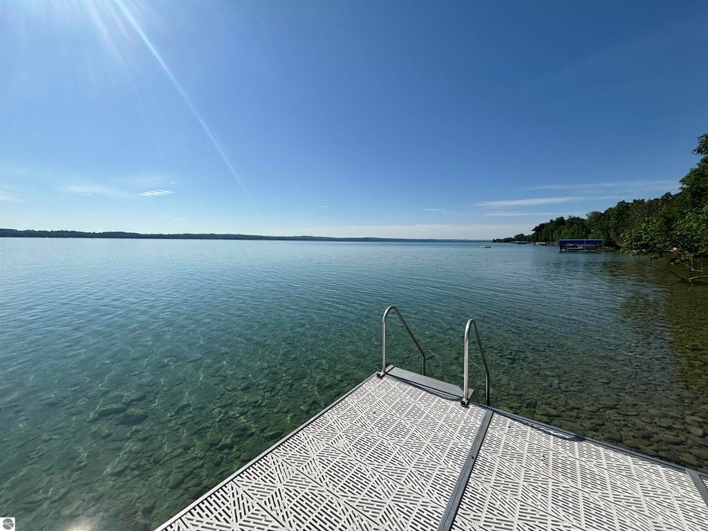 Image 2 of property listing at 7681 NW Torch Lake Drive, Kewadin, MI 49648