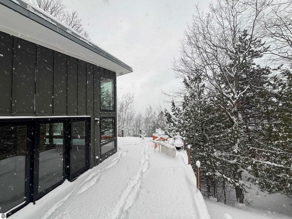 Image 28 of property listing at 7681 NW Torch Lake Drive, Kewadin, MI 49648