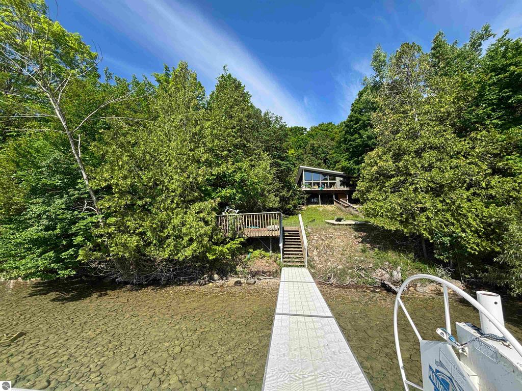 Image 3 of property listing at 7681 NW Torch Lake Drive, Kewadin, MI 49648