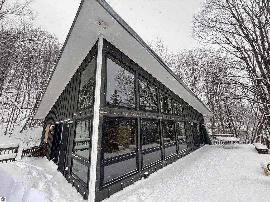 Image 5 of property listing at 7681 NW Torch Lake Drive, Kewadin, MI 49648