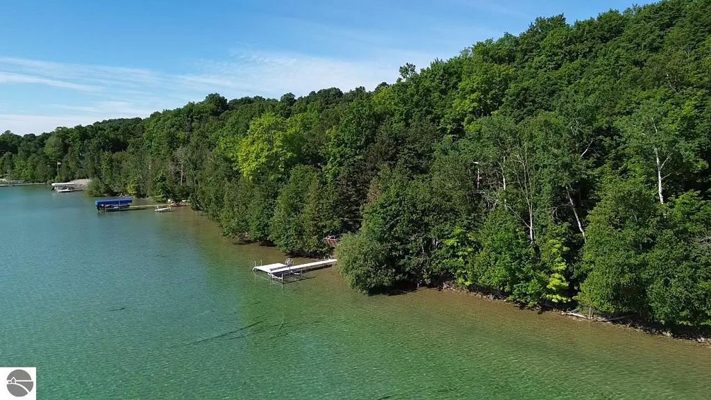 Image 9 of property listing at 7681 NW Torch Lake Drive, Kewadin, MI 49648