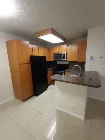 851 Lyons Road 22108, Coconut Creek, FL 33063