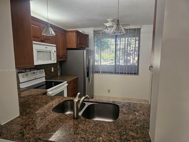 8592 W Sunrise Boulevard 209, Plantation, FL 33322