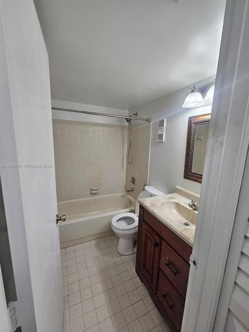 8592 W Sunrise Boulevard 209, Plantation, FL 33322
