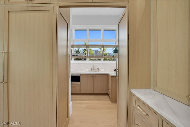 555 Whispering Pine LN, Naples, FL 34103