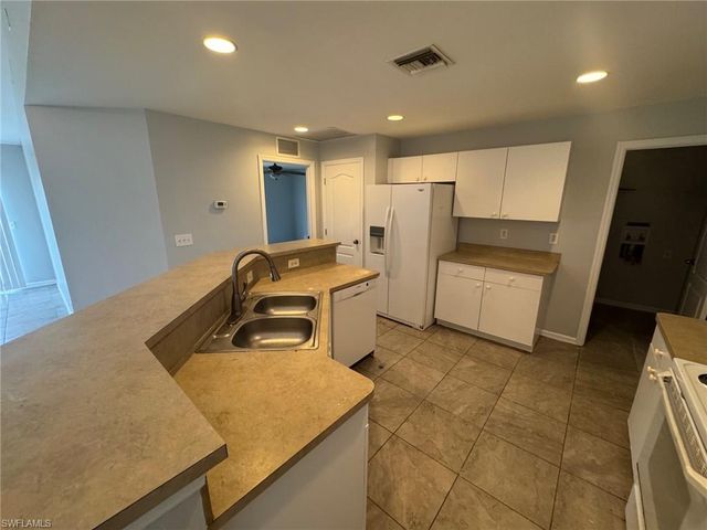 1063 Peach ST, Lehigh Acres, FL 33974