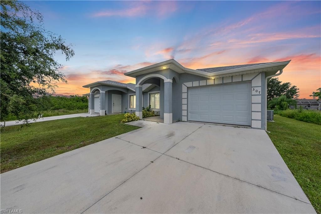 305-307 Hightower AVE S, LEHIGH ACRES, FL 33973 — exterior