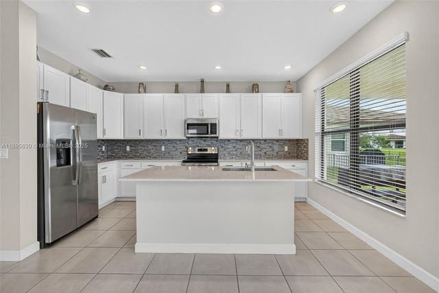 1310 Whitcombe Dr, Royal Palm Beach, FL 33411