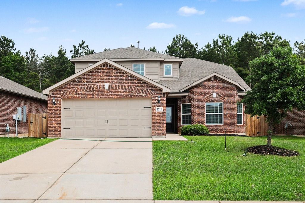 Image 2 of property listing at 7711 Boulder Sunstone Lane, Conroe, TX 77304