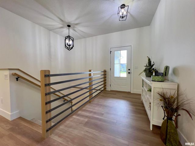 680 SWEET WOOD Lane, Blue Grass, IA 52726