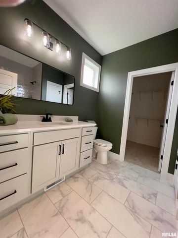 680 SWEET WOOD Lane, Blue Grass, IA 52726