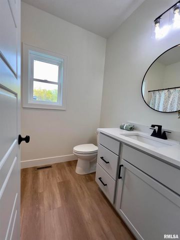 680 SWEET WOOD Lane, Blue Grass, IA 52726