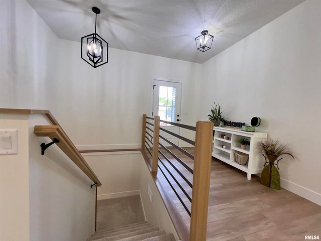 680 SWEET WOOD Lane, Blue Grass, IA 52726