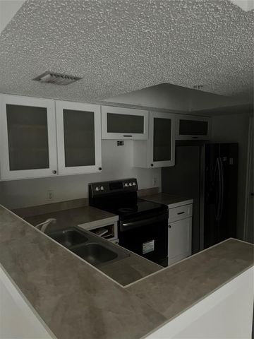 5031 Wiles Road 202, Coconut Creek, FL 33073