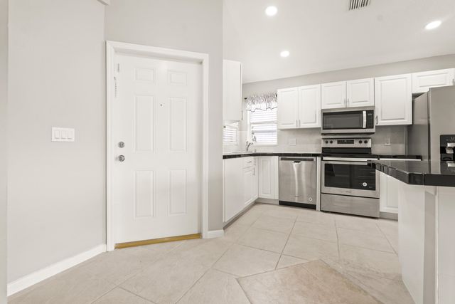 1209 PINE SAGE Circle, West Palm Beach, FL 33409