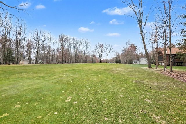 9362 Clubhouse Drive, Canadian Lakes, MI 49346