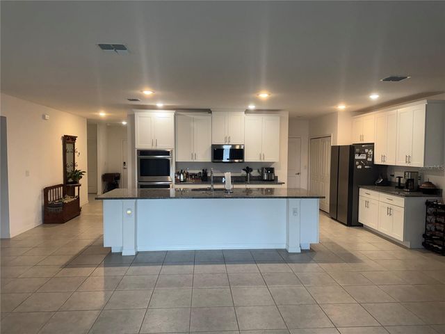 6615 RHYTHM DRIVE, Mascotte, FL 34753