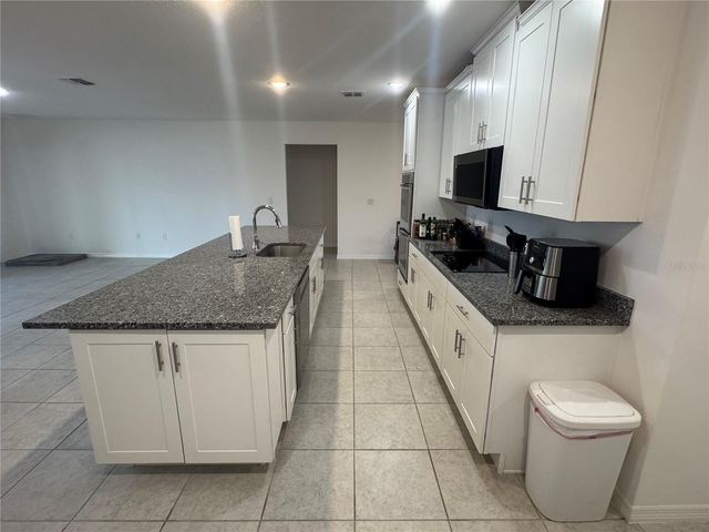 6615 RHYTHM DRIVE, Mascotte, FL 34753