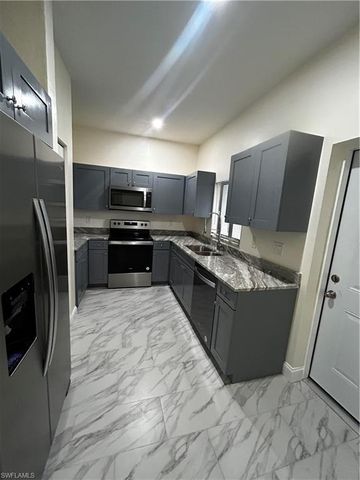 719 Harry AVE S, Lehigh Acres, FL 33973