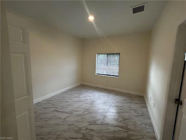 719 Harry AVE S, Lehigh Acres, FL 33973