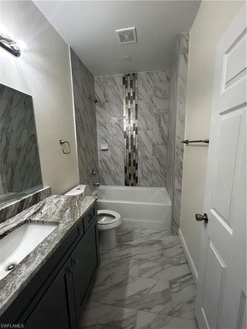 719 Harry AVE S, Lehigh Acres, FL 33973