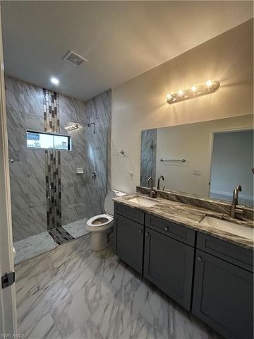 719 Harry AVE S, Lehigh Acres, FL 33973