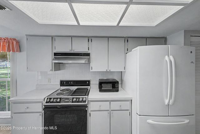 7088 Crown Oaks Drive, Spring Hill, FL 34606